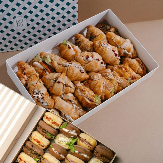 Box of assorted pastries on a neutral background