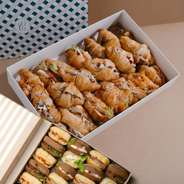 Box of assorted pastries on a neutral background
