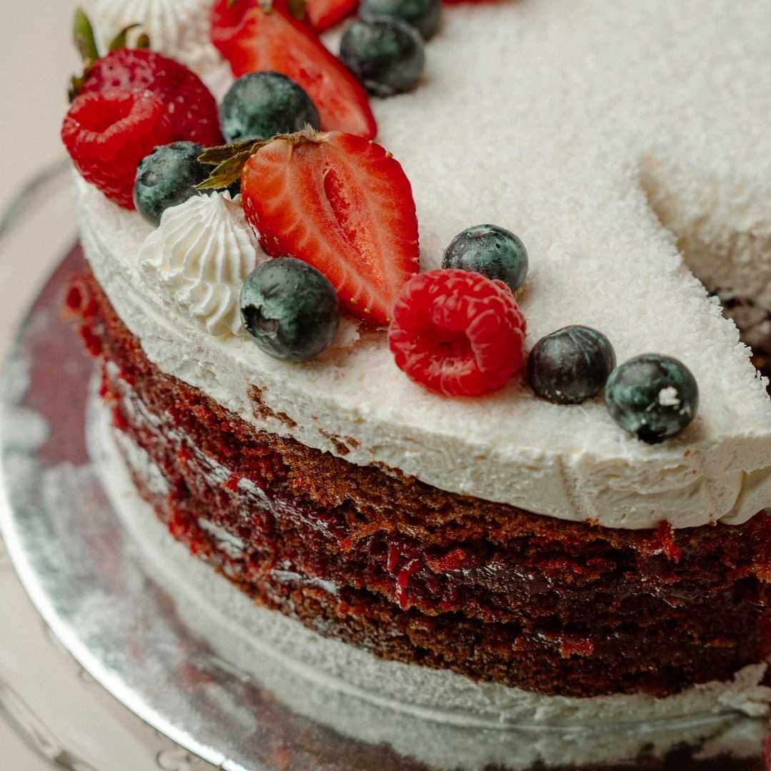 Coconut Berry Cake – Elegant top view with berries and coconut by Chantilly Cafe